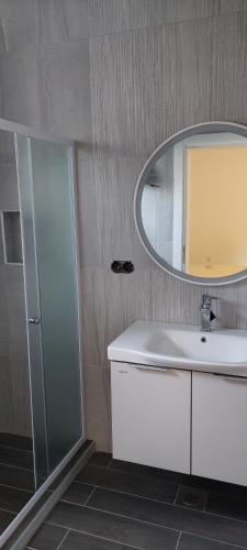 a bathroom with a sink and a mirror at Meem in Konjic