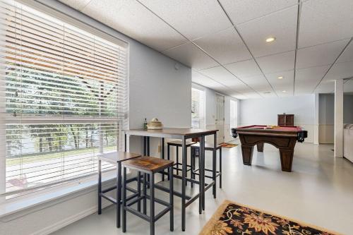 a living room with a table and a pool table at JJ's Great Escape in Eufaula