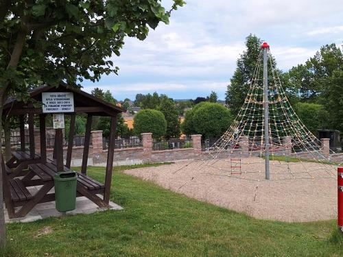 a playground in a park with a play structure at Dvouložnicový apartmán Sluníčko in Zásada