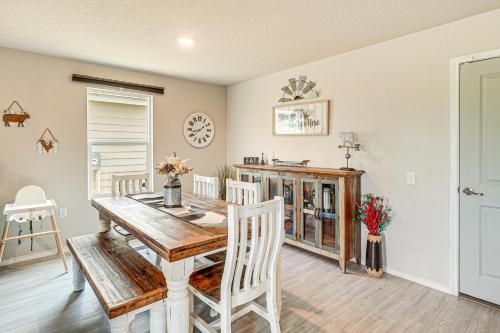 a dining room with a wooden table and chairs at 10 Mi to Dtwn Spacious San Antonio Home! in San Antonio