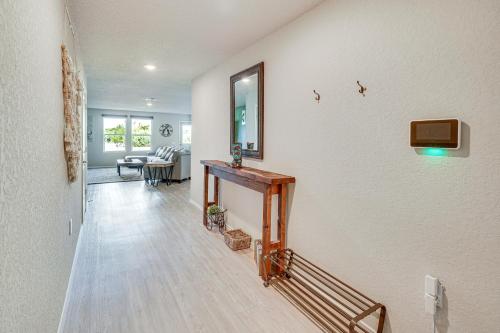a living room with a staircase and a mirror on the wall at 10 Mi to Dtwn Spacious San Antonio Home! in San Antonio