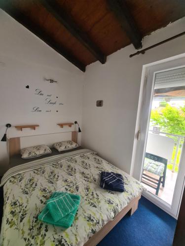 Postel nebo postele na pokoji v ubytování Apartman Daly