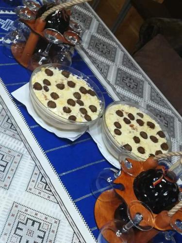 two cakes sitting on a tray on a table at Casa Gemenelor in Cluj-Napoca