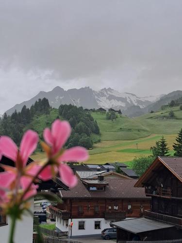 a view of a town with mountains in the background at Ferienhaus Enzian in Prägraten am Großvenediger