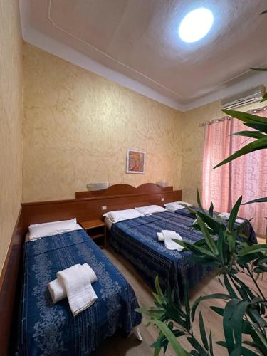 Postel nebo postele na pokoji v ubytování Hotel Casali