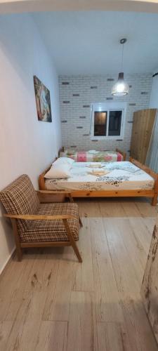 Postel nebo postele na pokoji v ubytování Velikis Apartments