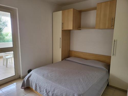 Ένα ή περισσότερα κρεβάτια σε δωμάτιο στο Residence Dolce Far Niente
