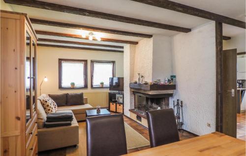 a living room with a couch and a fireplace at Ferienhaus 21 In Thalfang in Thalfang