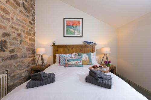 Postel nebo postele na pokoji v ubytování Stable Loft