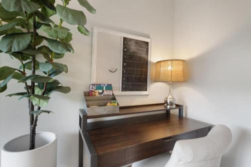 a desk in a room with a potted plant at Ski Vista Chic Condo Near the Canyons Slopes in Park City