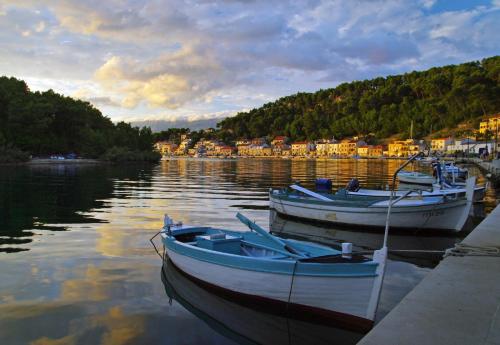 two boats are docked at a dock in the water at Studio Apartman Ivan in Novigrad Dalmatia