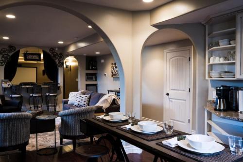 a dining room and living room with a table and chairs at Snuggle Down Inn 1BR In Law Basement Suite in Heber City