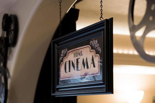 a picture hanging from a chain with the words home unagi at Snuggle Down Inn 1BR In Law Basement Suite in Heber City