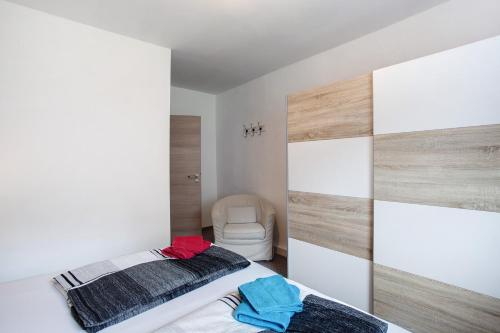 a bedroom with a bed and a chair at Fewo In Schustes in Willingen