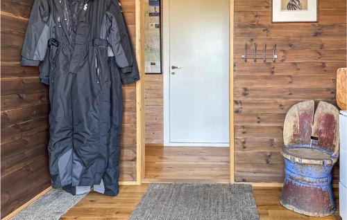 a room with a coat hanging next to a door at 3 Bedroom Awesome Home In Eggedal in Eggedal
