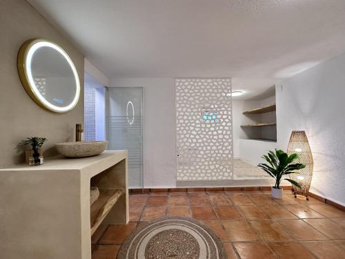 a bathroom with a shower and a sink and a mirror at Nono in Altea
