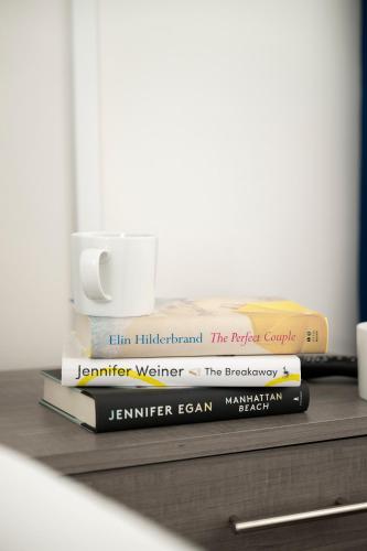 two books sitting on top of a table at Endless Dunes, A Modern Motel in Eastham