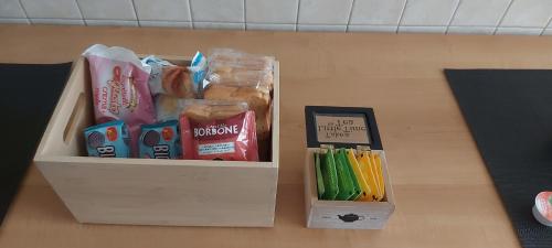 a box of school supplies sitting on a table at La Curta di Vegèss in Pregnana Milanese