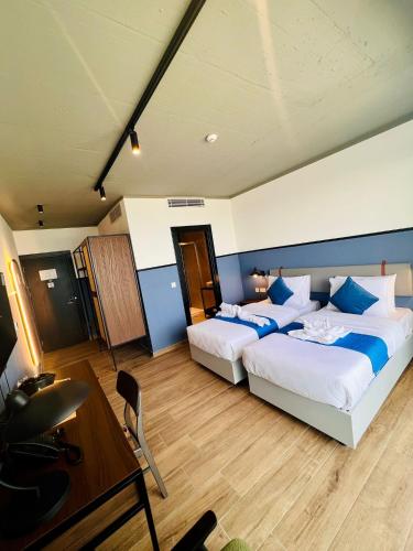 Ένα ή περισσότερα κρεβάτια σε δωμάτιο στο South32 Hotel