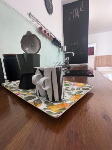 a tray of coffee cups sitting on a table at Beach LOFT Tabaiba in Tabaiba