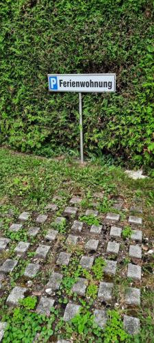 a street sign sitting on top of a brick road at Ferienwohnung in Weyregg am Attersee in Weyregg