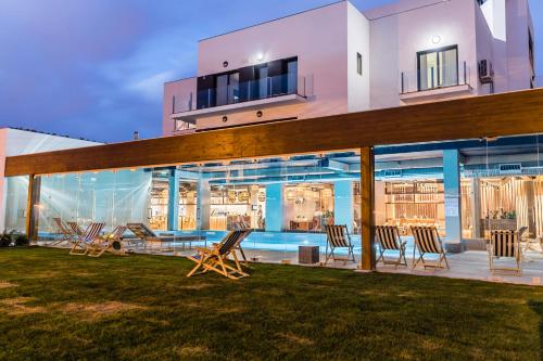 a house with a swimming pool and chairs at You and the sea in Ericeira