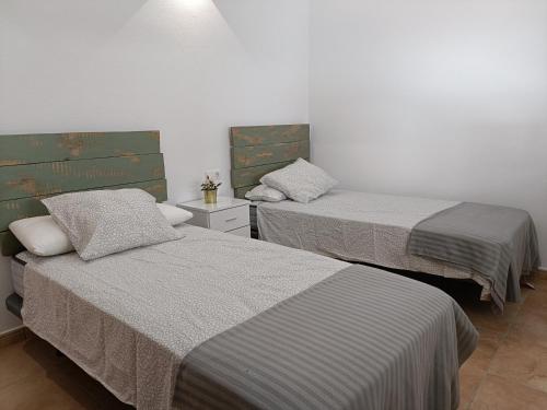 Postel nebo postele na pokoji v ubytování Aracena Centro