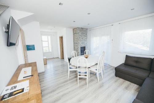 a living room with a table and a couch at Kuća za odmor Suha gora in Vrhovac