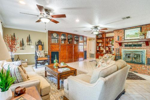 a living room with two couches and a fireplace at Charming Retreat with Patio Near GramblingandRuston! in Ruston