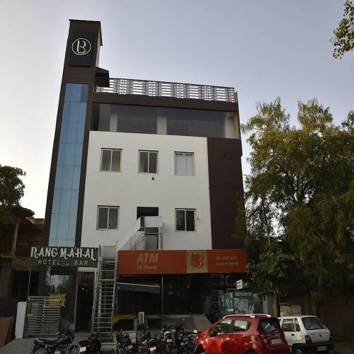 a building with a clock tower on top of it at Hotel Rang Mahal Near Jaipur International Airport in Jaipur