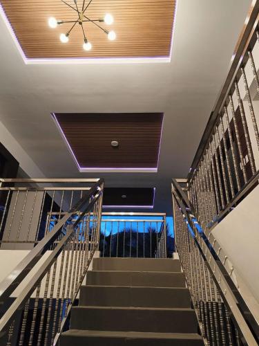 a staircase in a building with a ceiling at MGM Guest House in San Felix