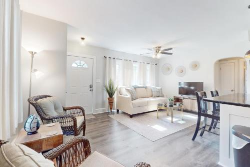a living room with a couch and a table at Wilmington Get Away in Wilmington