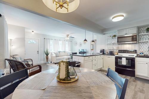 a kitchen and living room with a table and chairs at Wilmington Get Away in Wilmington