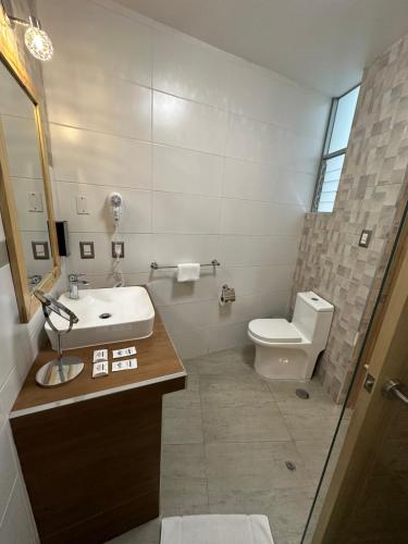 a bathroom with a sink and a toilet at CASA CRISTOBAL Centenario in Cusco