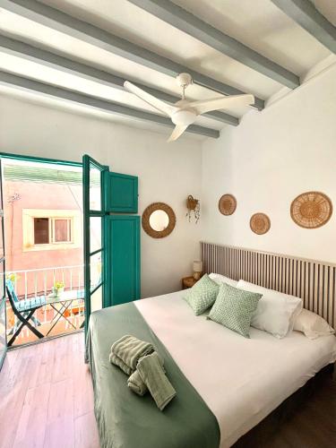 a bedroom with a bed and a ceiling fan at Old Town Blue Suite in Villajoyosa