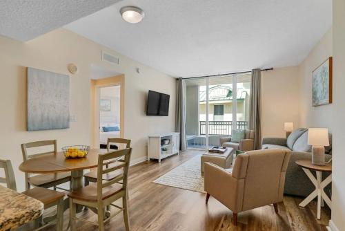 a living room with a couch and a table at 1 BR King- Rooftop Pool close to beach Casa Costa in Boynton Beach