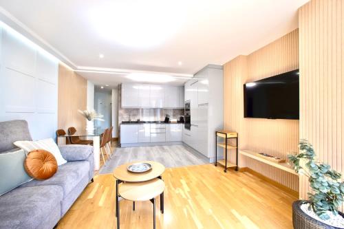 a living room with a couch and a table at Rosalia Park by Lugo Collection in Lugo