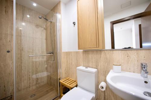 a bathroom with a toilet and a sink and a shower at Rosalia Park by Lugo Collection in Lugo