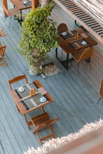 an overhead view of a table and chairs on a deck at Villa Praia - La Villa Group in Jericoacoara