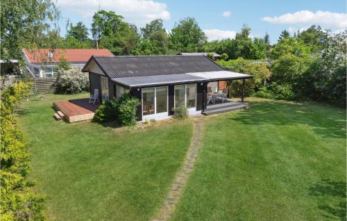 an overhead view of a small house with a large yard at Cozy Home In Kirke Hyllinge With Wifi in Kirke-Hyllinge