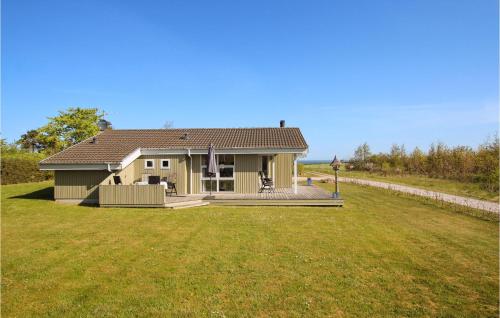 a house with a large yard in front of it at 2 Bedroom Lovely Home In Samsø in Onsbjerg