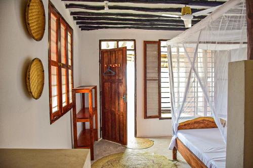 Llit o llits en una habitació de Tropical Beach Studios