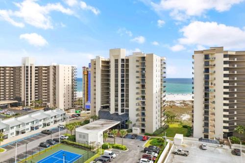 an aerial view of apartment buildings and the beach at Phoenix VIII-8206 by Vacation Homes Collection in Orange Beach