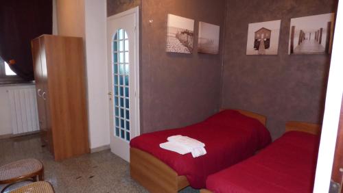 Posteľ alebo postele v izbe v ubytovaní La Pergola