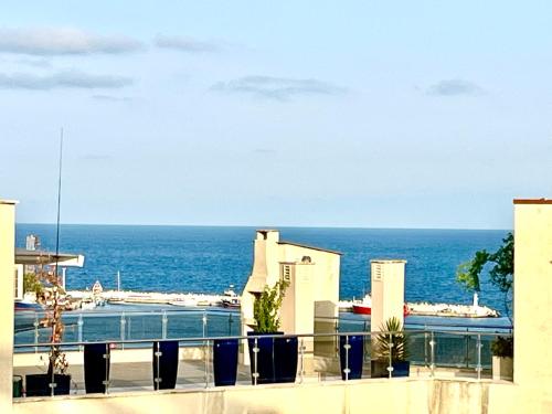 a view of the ocean from the balcony of a building at Julia Vigo Panorama apartments in Nesebar