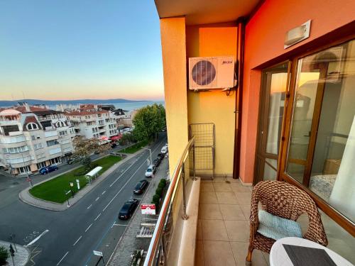 a balcony of a building with a view of a street at Julia Vigo Panorama apartments in Nesebar