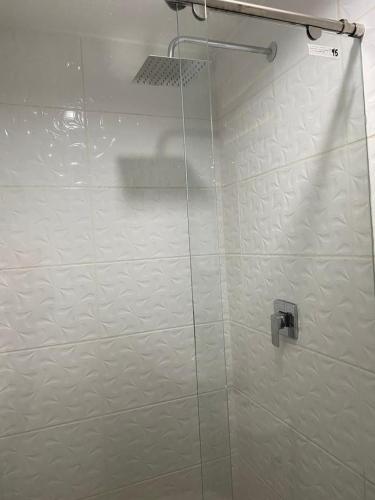 a shower with a glass door in a bathroom at Hotel Orduz Centro Histórico de Cali in Cali