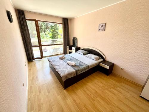 Ένα ή περισσότερα κρεβάτια σε δωμάτιο στο Vadim Apartments in Panorama Beach Vigo Nessebar