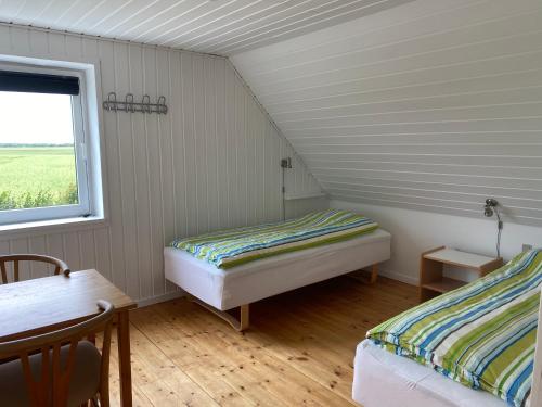 Postel nebo postele na pokoji v ubytování Gaardensminde