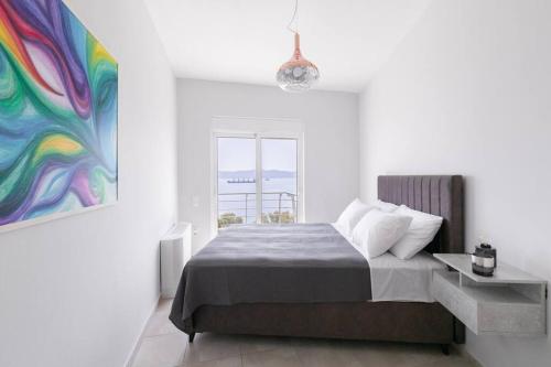 Katil atau katil-katil dalam bilik di Peaceful modern appartment near Lavrio port